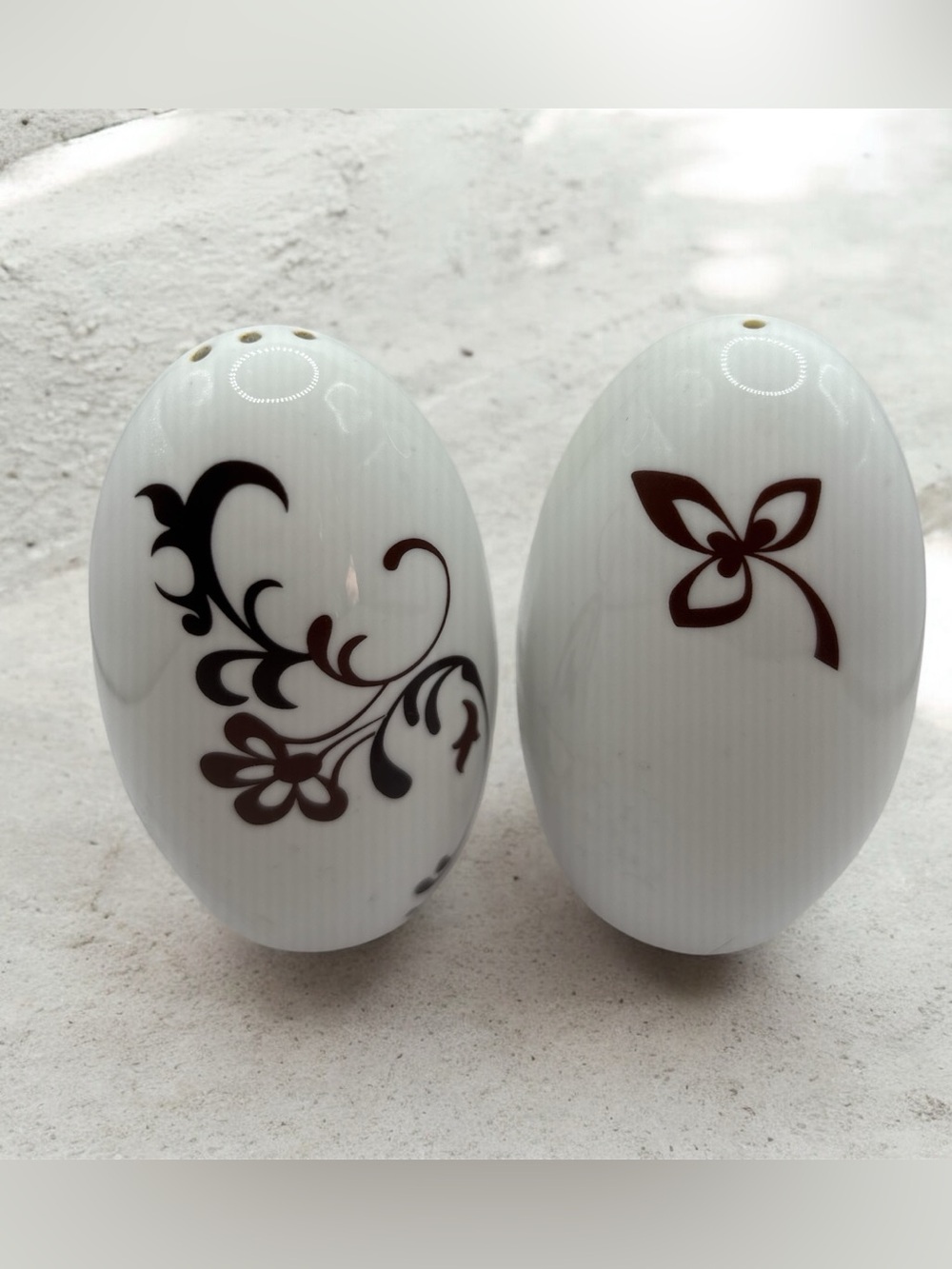 Mikasa Chocolate Swirl salt and pepper shakers, featuring white porcelain
